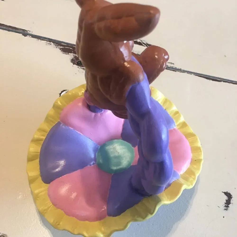 Ceramic Easter bunny hanging from basket